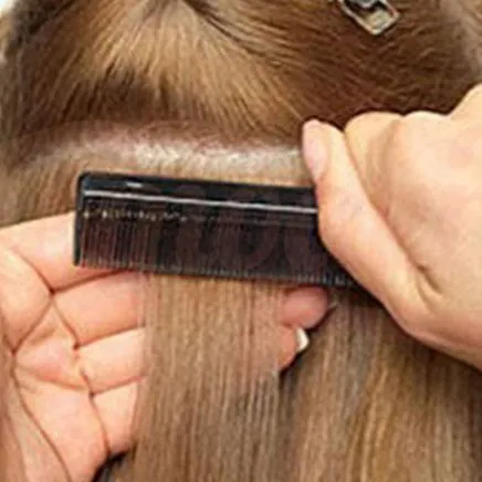 Use comb through the tape area and make sure it is flat